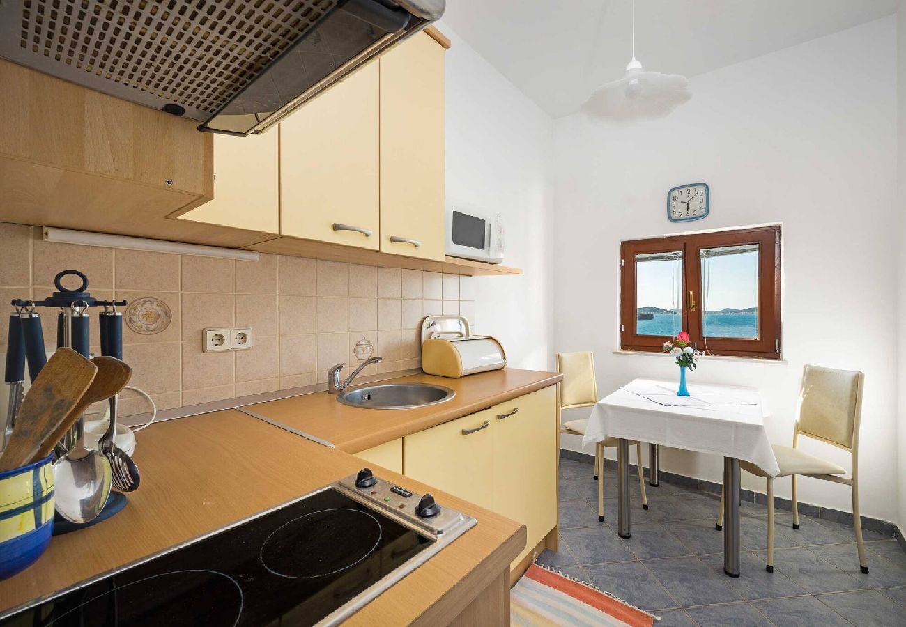 Ferienwohnung in Tisno - Apartments Kaina - one bedroom apartment with a sea view (blue)